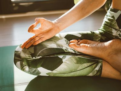 Close up detail of hands in a yoga position